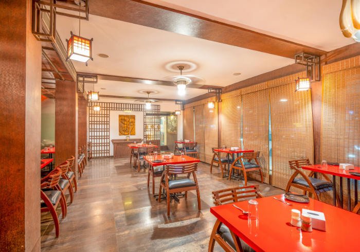 Themed private lounge with wooden screens and lanterns