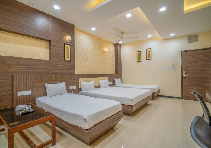 Family room with three beds and study chair
