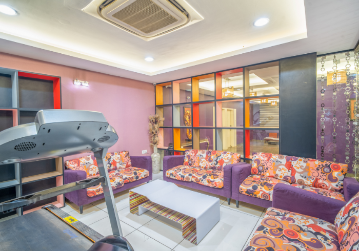 Executive lounge with treadmill for premium room guests at Hotel Varun