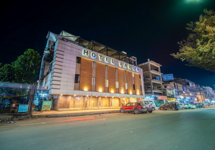 Hotel Varun exterior at night on AB Road