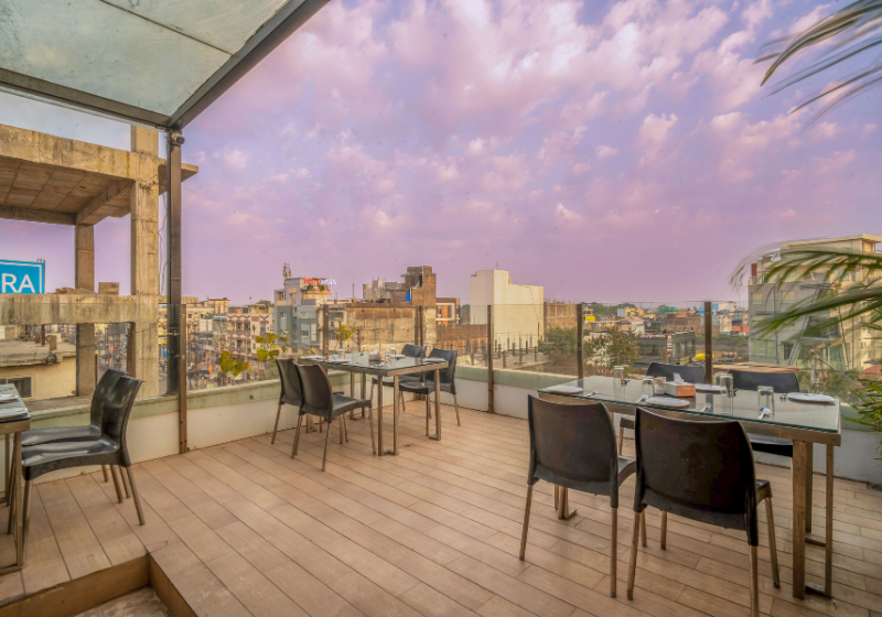 Terrace seating with glass railing at dusk