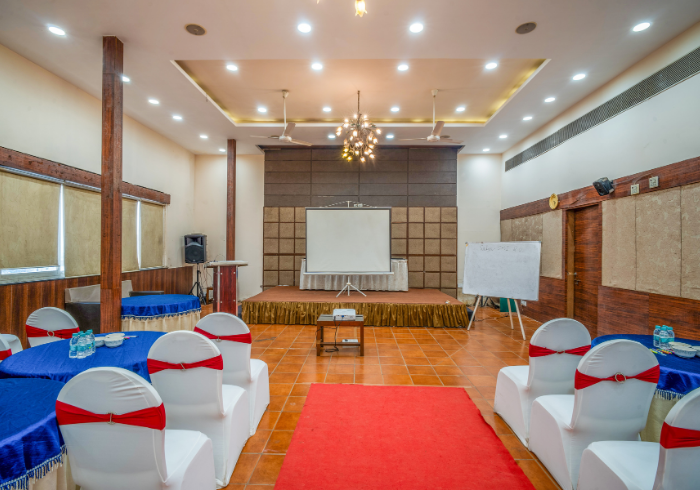 Orion hall arranged for a seminar with projector screen