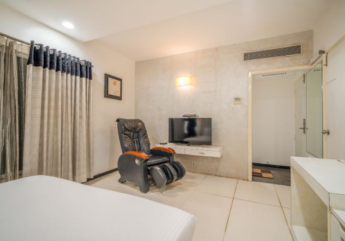 Suite with massage chair and TV