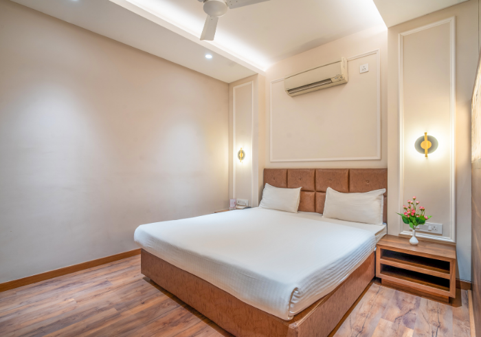 Super Deluxe room double bed with wall lights