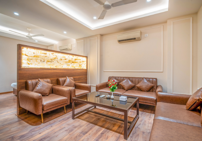 Super Deluxe room living area with backlit panel