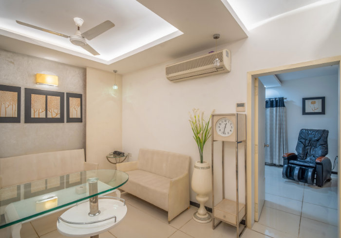 Super Deluxe room seating with massage chair