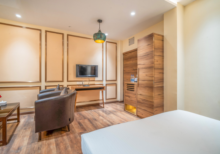 Super Deluxe room sitting area with armchair