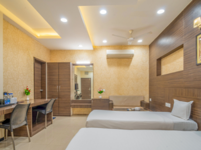 Family-friendly hotel room with modern amenities in Guna